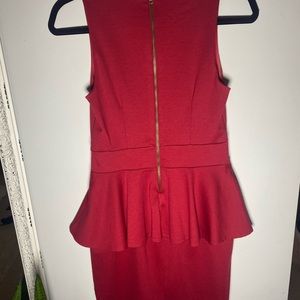 Tight fitted, red dress with ruffle.